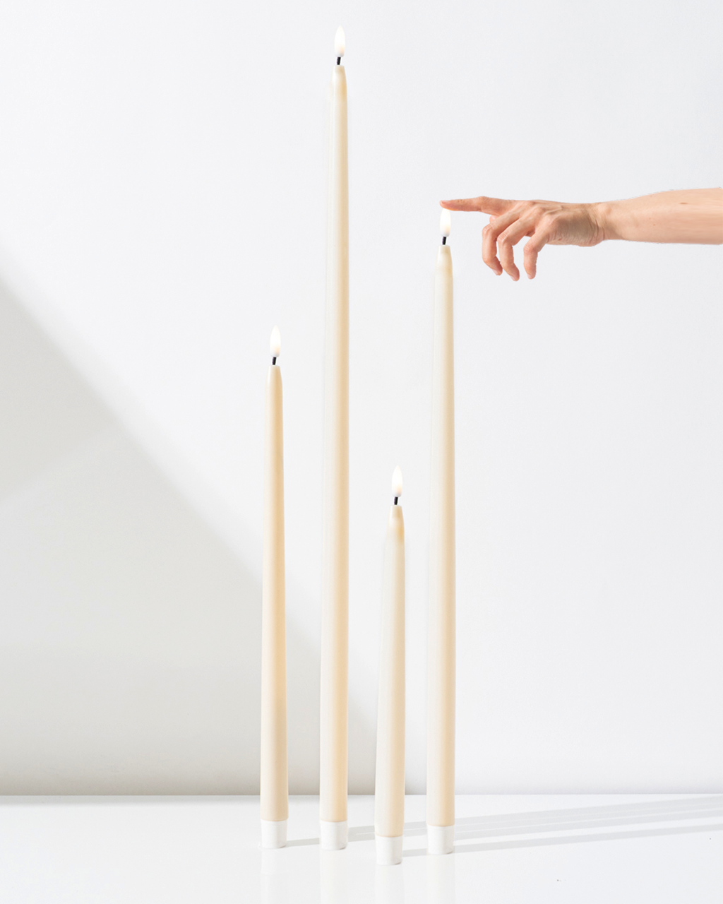 ULTRABRIGHT™ Ivory LED Flameless Taper Candles for Hire - 28cm